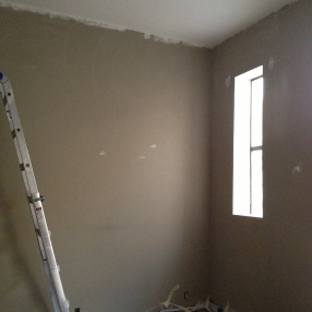 Patching and prepping the walls.
